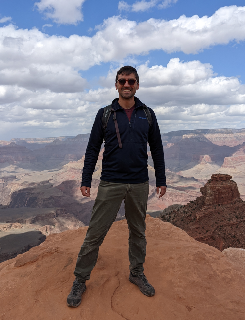 Image of the author standing at the Grand Canyon